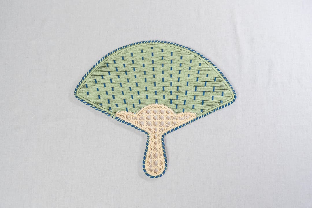 JNC Fan-Shaped Paper Yarn Placemat - Pavo